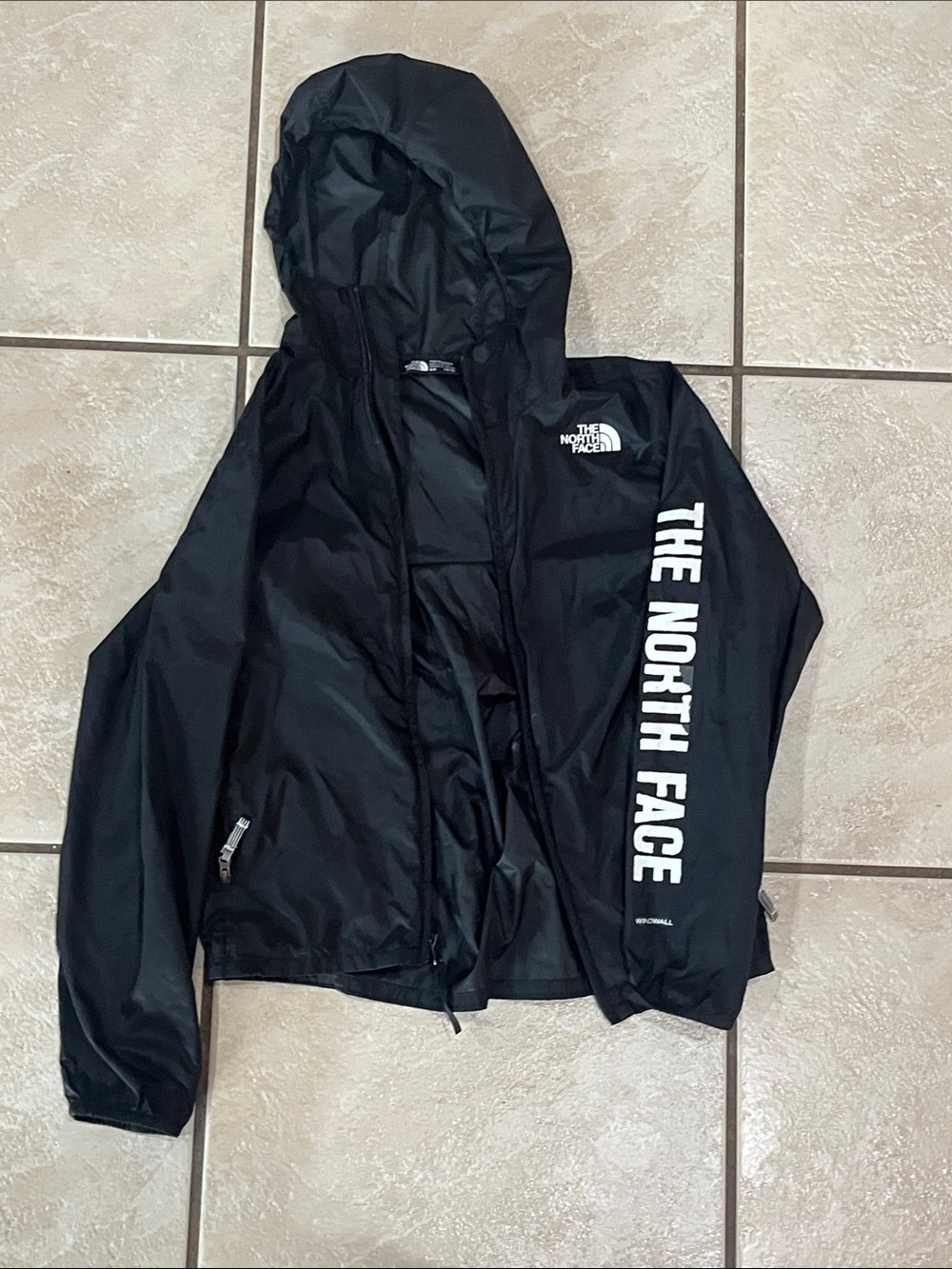 The North Face Black Hooded Raincoat with White Sleeve Logo